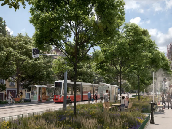 A Flexity tram surrounded by multiple trees, green spaces and a bike path